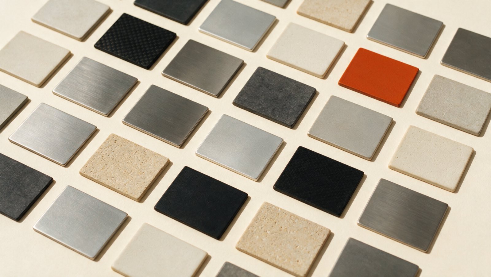 A specimen board of material samples on warm paper